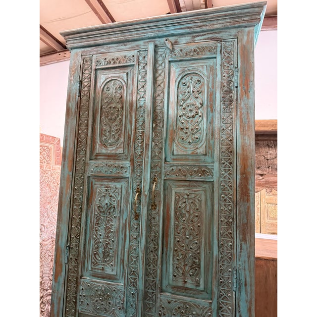 1920s Antique Blue Hand-Carved Armoire With Brass Studs – Floral Statement Bedroom Cabinet For Sale - Image 5 of 8