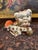 A wonderful pair of hand-painted Japanese Kutani ceramic foo dogs, or guardian lions, decorated in traditional iron red,...