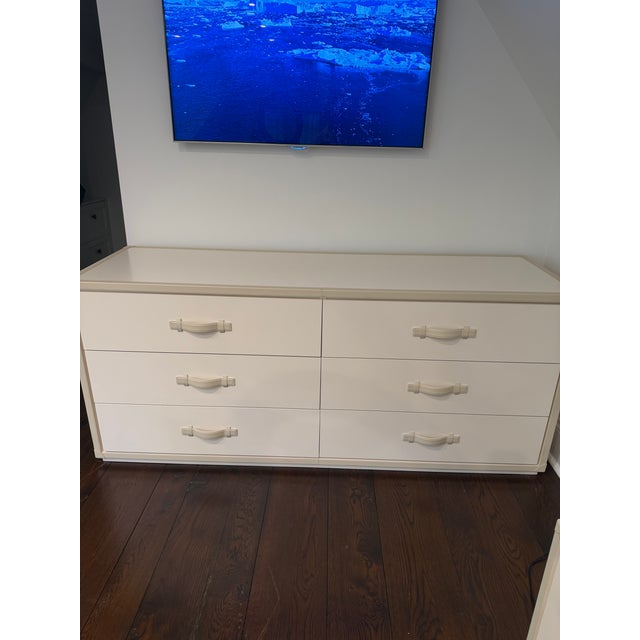 Elegant and highly unusual, this coordinated bedroom suite by Heritage furniture features a six drawer dresser accompanied...