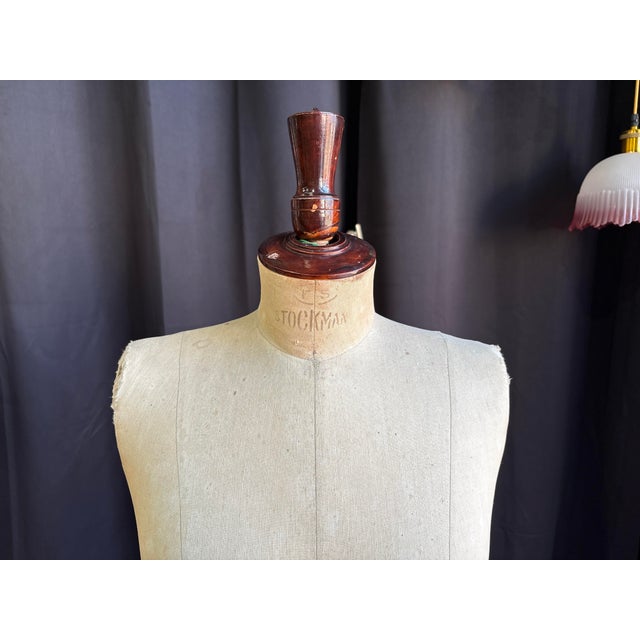 Authentic antique Stockman Paris dress form, women's size 42, mounted on its elegant tripod base in mahogany-stained wood....