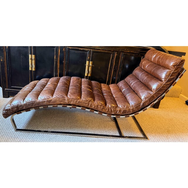 Inspired by the retro design of the 1960s the chair consists of a series of leather cushions, each handcrafted, connected...