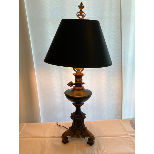 Unique handpainted, marbelized metal lamp in hunter green, black and gold. Stands 28” high table lamp. Base is 8” with...