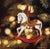 This oil on panel piece depicts a charming rocking horse ornament, delicately detailed with vibrant colors and a festive...