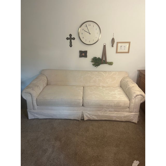 Classic elegance meets lasting craftsmanship in this vintage Kroehler sofa, made in Conover, North Carolina in the mid...