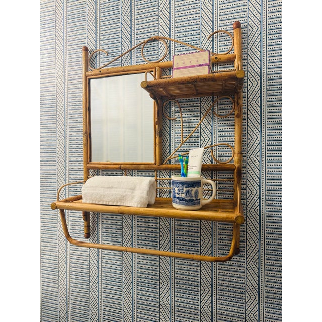 Vintage bamboo! This is such a wonderful piece. This vintage bamboo shelf with mirror and towel rack. The bamboo is in...