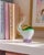 A captivating and joyful piece of decorative art glass, this hand-blown elephant figurine raises its trunk skyward in the...