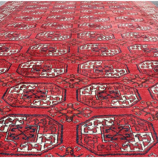 Hand-Knotted Vintage Turkomen Ersari Rug in Wool with Repeating Gul Design. Hand-Knotted Red vintage Ersari Rug with Gul...