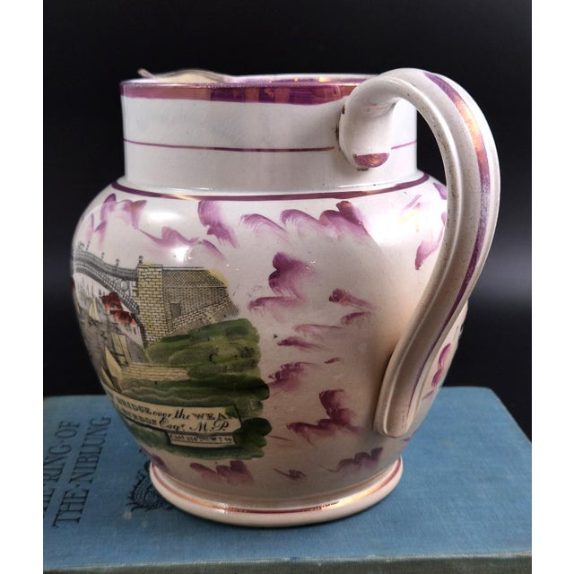 An english sunderland pink splash-lustre pearlware presentation jug, made in the sunderland area of north-east england and...