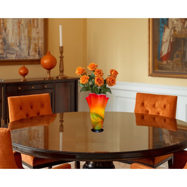 This 11‑inch hand‑blown Murano fazzoletto vase has a tall, tapering profile that rises smoothly before opening into a...