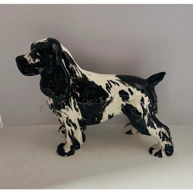 This is a stunning English springer spaniel figurine, done in a glazed ceramic. The piece is unmarked. CGr