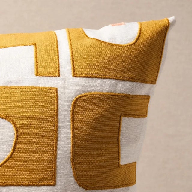 This pillow features Den Applique by Hadiya Williams for Schumacher with a knife edge finish. Hadiya Williams’ Den...