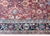 A stunning early 20th century Persian Sultanabad rug with an allover mirrored floral and scrolling vine pattern woven with...