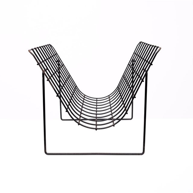 Very nice Magazine Rack . Black Metal thread .timeless Design . 1970s Holland . I have official proof of authenticity such...