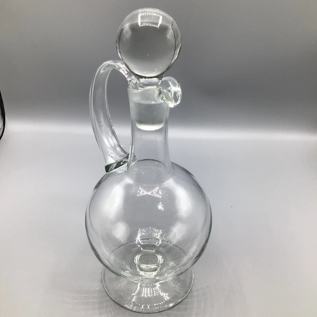 Perfect hand blown decanter with large round stopper, handle and pour spout.