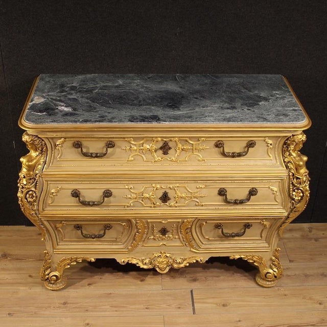 Italian chest of drawers from the first half of the 20th century. A curved furniture, crafted from finely carved,...
