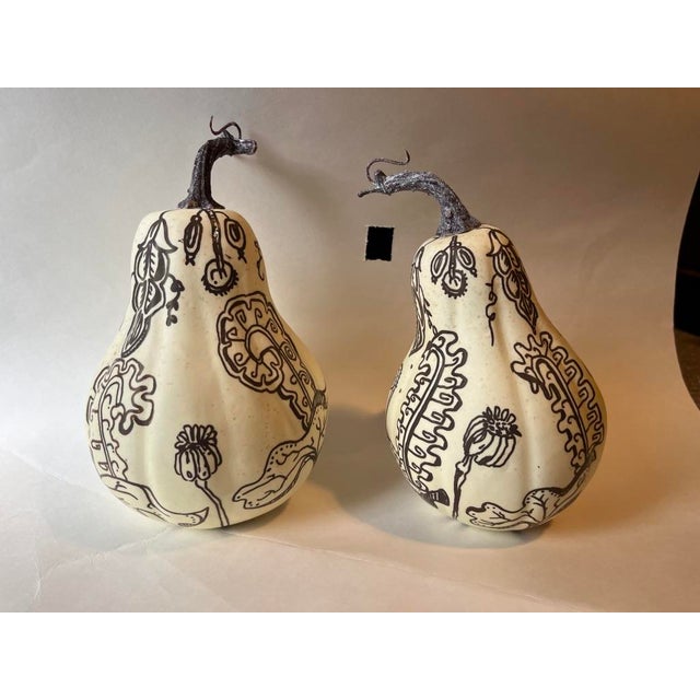 A matching pair of hand painted life size faux cream colored gourds. Perfect for use in a fall tablescape or as mantel...