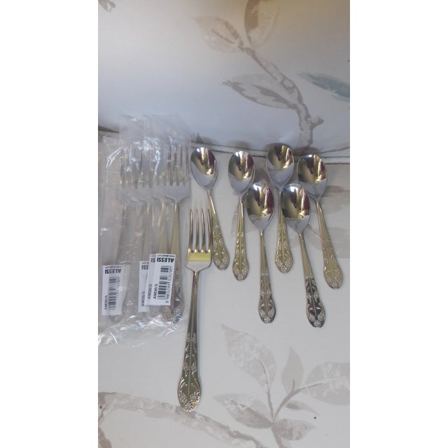 Alessi "Asta Barocca" by Alessandro Mendini, fruit forks and coffee spoons in stainless steel with relief decorations of...