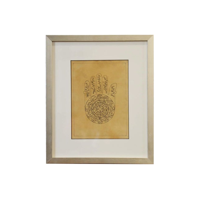 An astrological print depicting a hand with calligraphy from the mid 20th century, hand-painted on parchment. Found in...
