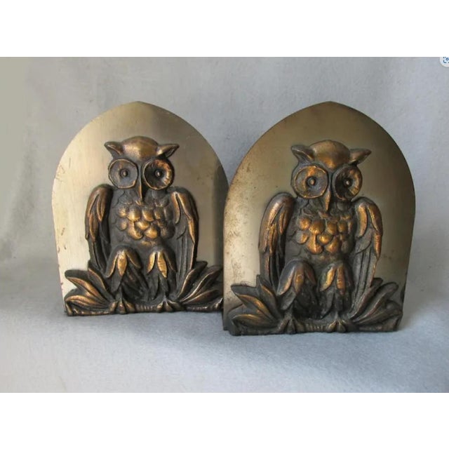 A set of Antique Arts & Crafts, Mission Great Horned Owl Bookends. The Bookends are made of mixed metals and are signed...