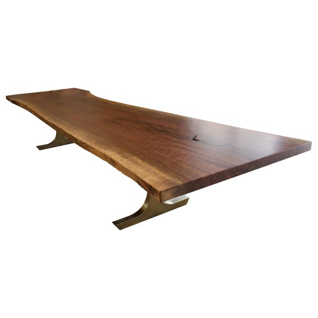 Featuring our Made In New York Collection. Impressive hand made live edge walnut dining table with a custom bronze base....