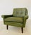 Made in Denmark by Svend Skipper, a beautiful classic Danish lounge chair upholstered in soft Olive green leather, the...