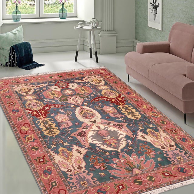 Elevate your home decor with this stunning Boho Chic Ziegler Diezel Blue/Pink Wool Rug. Hand-knotted by skilled Turkish...