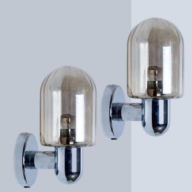 1 of the 2 high-end wall sconces made chrome colored hardware. Designed and produced by markslöjd in sweden. Minimalistic...