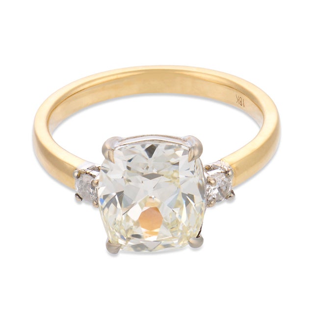 This remarkable engagement ring centers on an impressive 3.02 carat old mine cut diamond, certified by GIA #7533412445,...