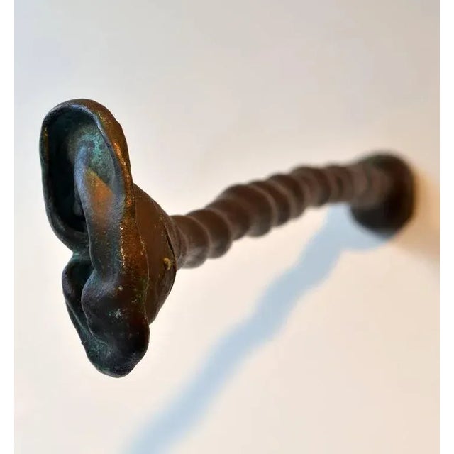 Surrealist Bronze ear sculpture signed P. Perdiues '97 Belgium comes away from the wall. It is easy to mount on the wall.