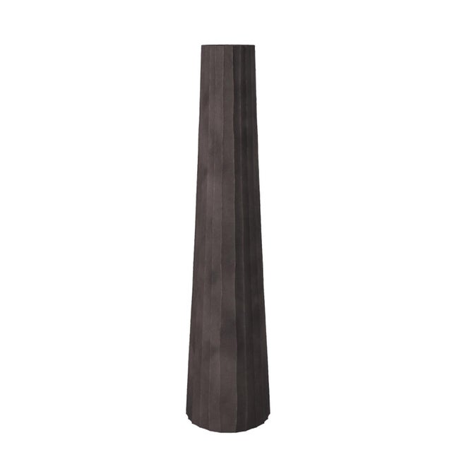 This metal vase features a tapered, triangular shape. It is characterized by a chiseled texture etched into the metal. It...