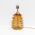 Elegant pair of table lamps featuring cylindrical bodies crafted from amber-coloured Murano glass using the refined...