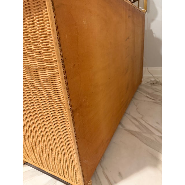 A stunning piece of designer coastal living, this vintage Polo Ralph Lauren wicker and rattan bowfront dresser is a rare...