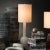 A quietly modern glass lamp in a graceful white glass. Made of hand-blown glass 100% Linen Tall Thin Drum Shade Acrylic...