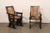 A Spanish pair of wooden armchairs with rushed back and seats from the mid 20th century. These mid-century chairs from...