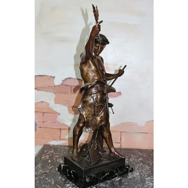 Regula sculpture with brown/gold patina entitled 'l'olivier le rameau du travail' and signed e. Picault, depicting a...