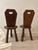 A wonderfully primitive early-20th-century set from the French Alps: two hand-carved chairs and a matching stool that...