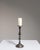 This early 20th century candlestick from France is finished in gray, worked in silver. Its form follows honest, well-...