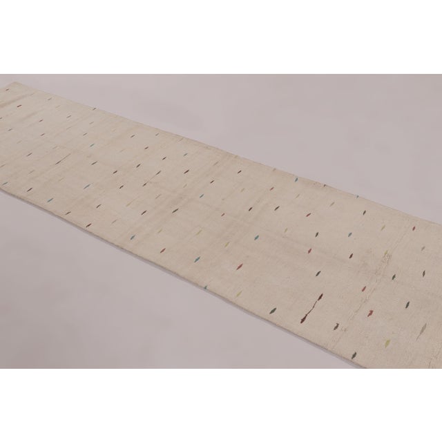 Handwoven in hemp circa, this 3x11 modern runner rug presents a refined, minimalist interpretation of traditional textile...