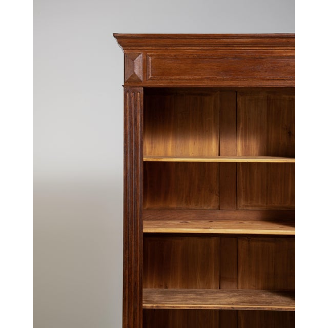 A utilitarian yet character-rich bookcase featuring original patina, which adds both authenticity and visual depth....