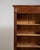 A utilitarian yet character-rich bookcase featuring original patina, which adds both authenticity and visual depth....
