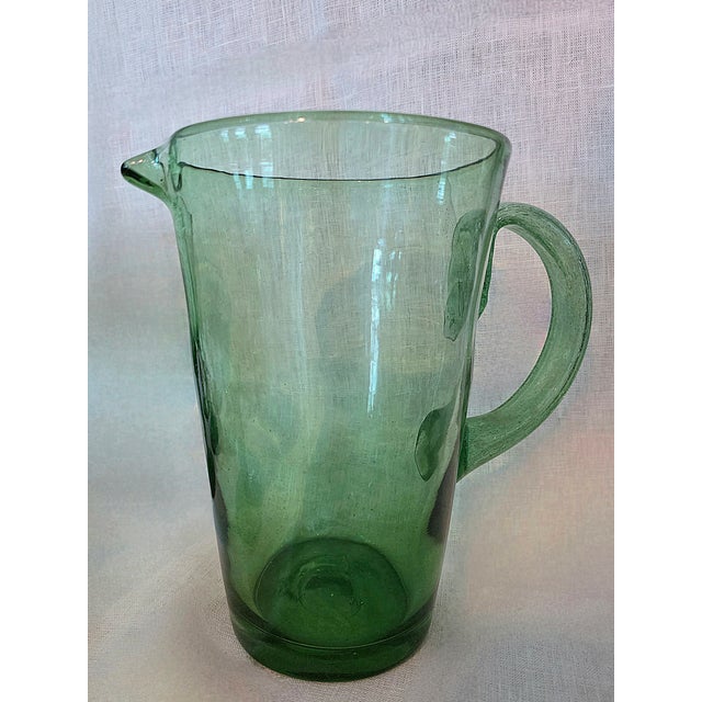 Set of 6 handblown green glass goblets and pitcher from Italy. Made from recycled glass with dimpled textures. Goblets...