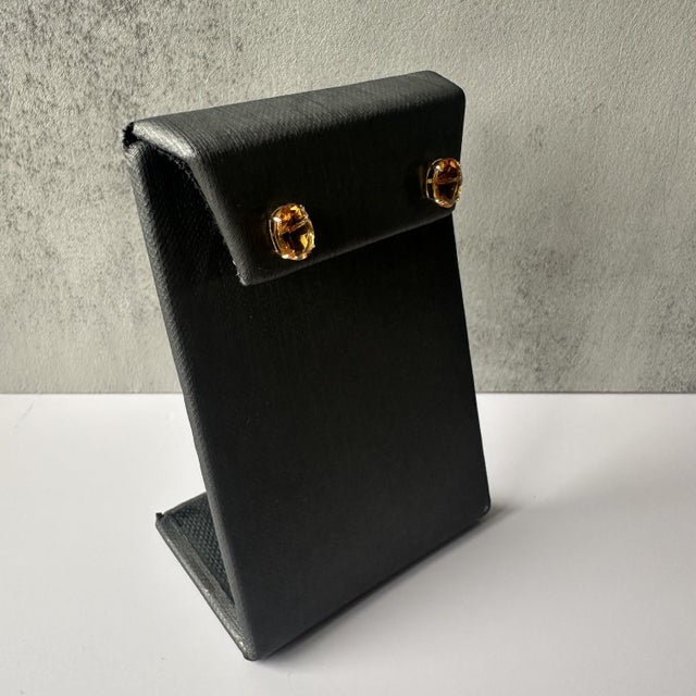 These stunning Citrine Stud Earrings in 14kt Yellow Gold feature 8x6mm oval citrine gemstones, offering a vibrant burst of...