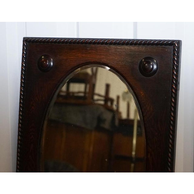 This handsome antique wall mirror is crafted in solid oak and reflects the honest simplicity and craftsmanship associated...