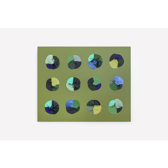 Logan Ledford's classic geometric, textured design with bold blue colors upon a deep, mossy green background.
