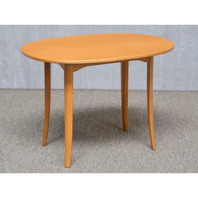This rare pair of side tables was designed by Carl Malmsten and produced by Carl Löfving & Söner in Tibro, Sweden in the...