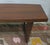 Unusual Danish coffee table, the top curved on one side, standing on sled legs. No markings, but attributed to Leif Hansen...