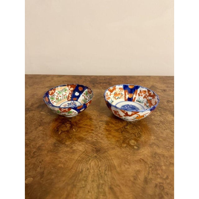Two small antique Japanese imari bowls, having two antique Japanese imari bowls with wavy shaped rims, decorated with...