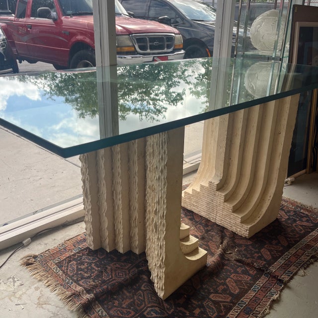 Double Carved waterfall shape travertine pedestals base. Pedestals each have an 18.5”x11” footprint. Stands 29.25” to top...