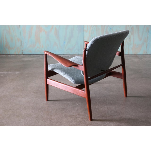 An early France lounge chair in teak and wool, model 136 designed by Finn Juhl for France and Daverkosen c. 1950s. Early...