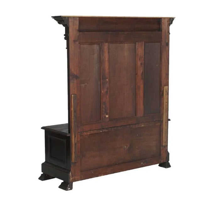 This 1890s Renaissance Revival Florentine bench chest is made of solid hand carved ebonized walnut.